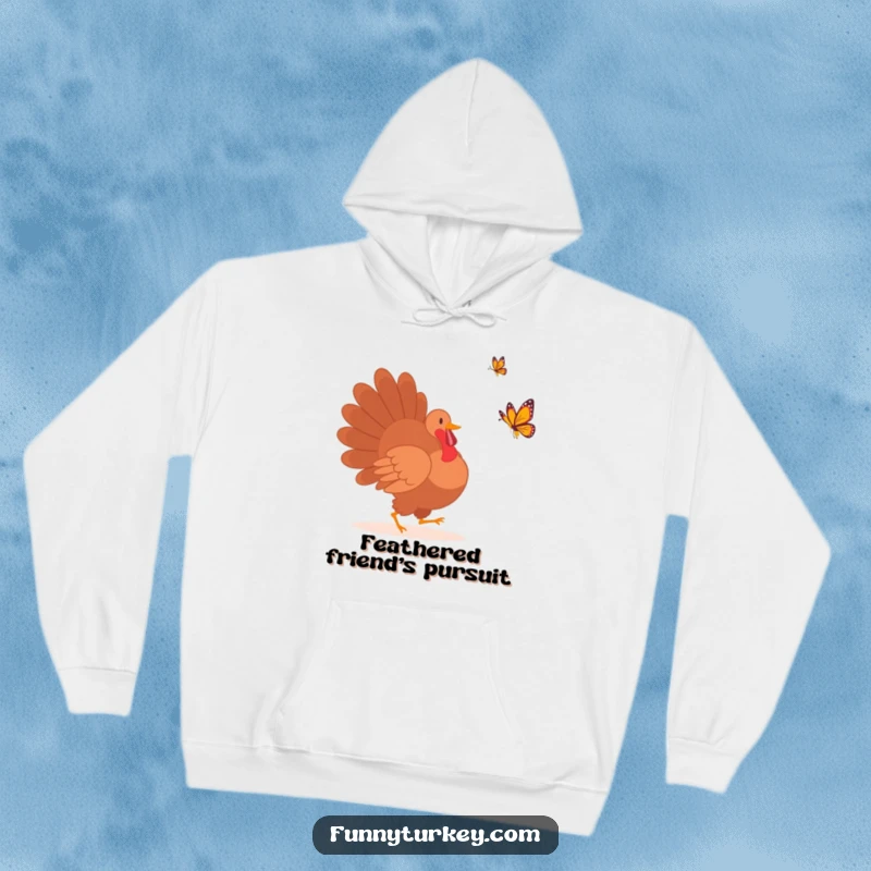 Comfortable hoodie featuring a funny turkey silhouette playfully pursuing a colorful butterfly, perfect for cozy humor.